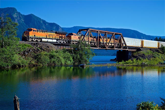 A Tier 4 locomotive pulls an automotive train near Stevenson, Washington. A Tier 4 locomotive pulls an automotive train near Stevenson, Washington.